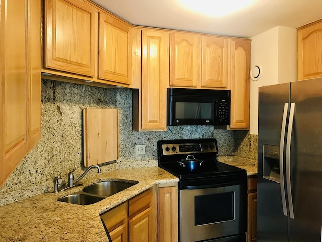 195 N Harbor Dr Unit 207, Chicago, IL 60601 - kitchen featuring stainless steel range with electric cooktop, black microwave, refrigerator with ice dispenser, a sink, and backsplash