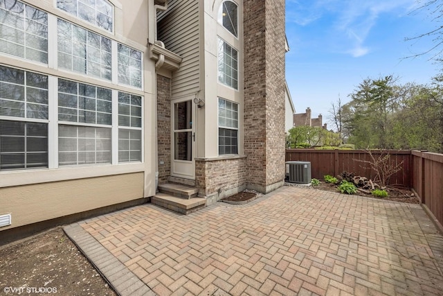 view of patio featuring a fenced backyard and central AC unit