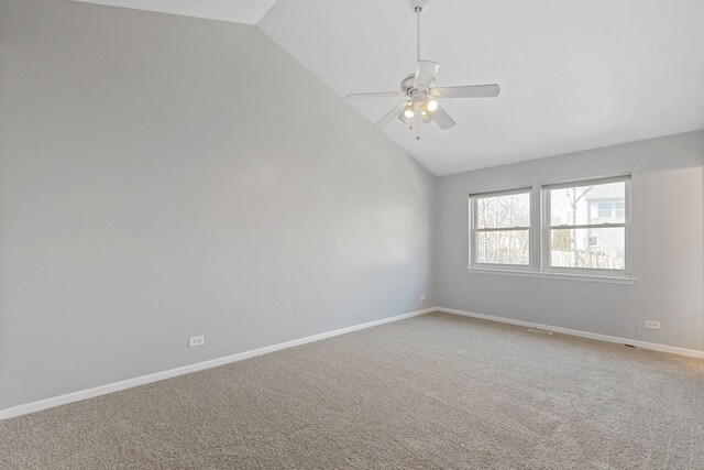 unfurnished room with light carpet, baseboards, ceiling fan, and vaulted ceiling