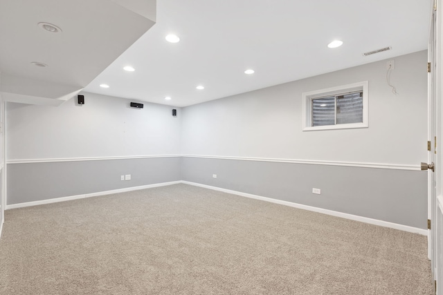 spare room with recessed lighting, visible vents, carpet floors, and baseboards