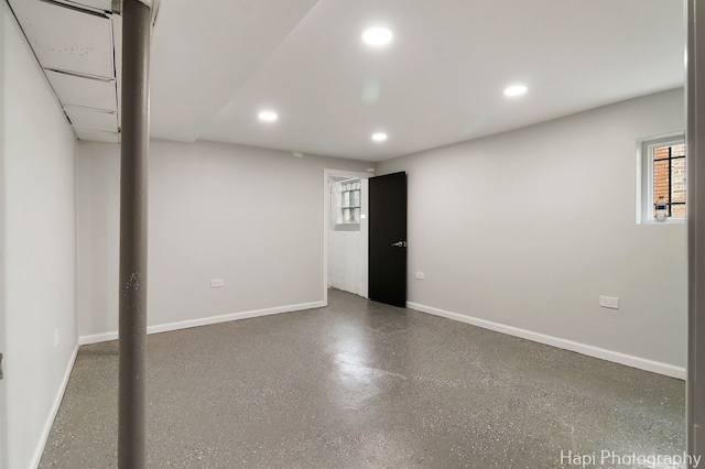 below grade area featuring recessed lighting, plenty of natural light, and baseboards