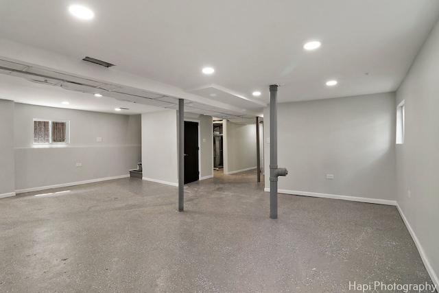 below grade area featuring recessed lighting and baseboards