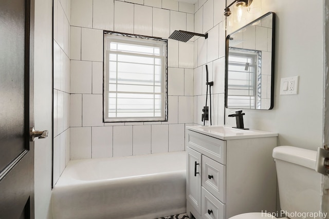 full bathroom featuring toilet, vanity, and shower / washtub combination