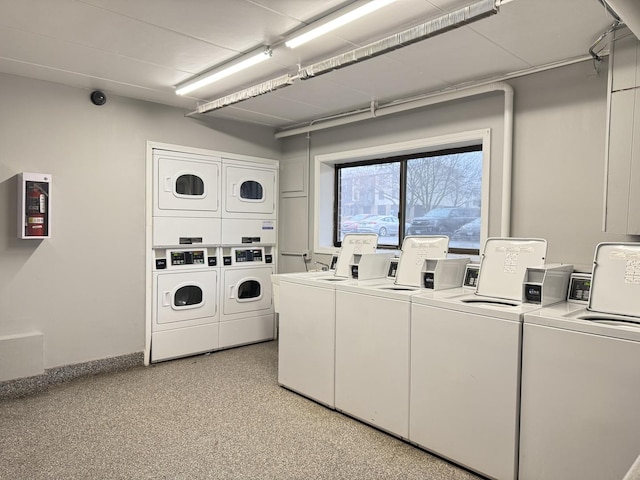 shared laundry area featuring separate washer and dryer and stacked washer / dryer