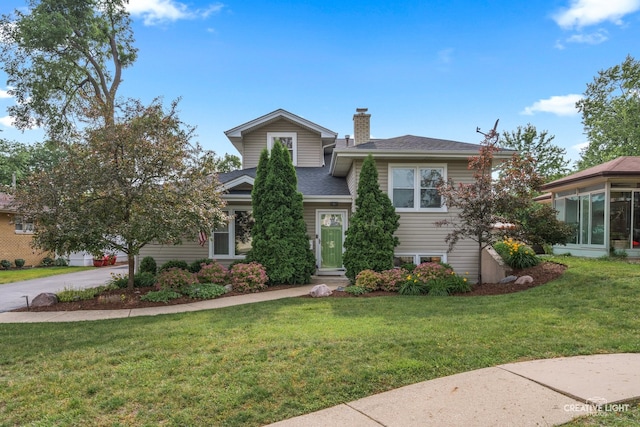 432 S Cherry St, Itasca, IL 60143 - split level home with a chimney, a front yard, and a shingled roof