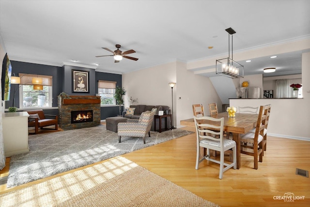 432 S Cherry St, Itasca, IL 60143 - dining room with wood finished floors, ornamental molding, a fireplace, and ceiling fan