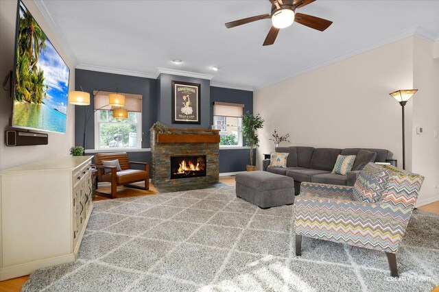 432 S Cherry St, Itasca, IL 60143 - living room featuring a ceiling fan, crown molding, and a stone fireplace