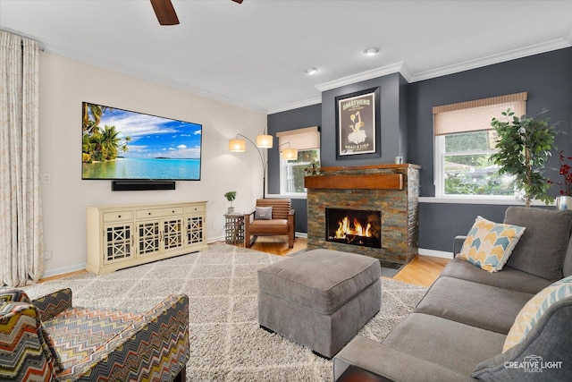 432 S Cherry St, Itasca, IL 60143 - living area featuring wood finished floors, crown molding, a ceiling fan, a stone fireplace, and recessed lighting