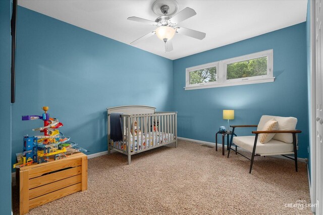 432 S Cherry St, Itasca, IL 60143 - bedroom with carpet flooring, a crib, and a ceiling fan