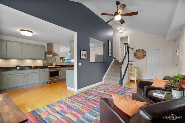 432 S Cherry St, Itasca, IL 60143 - living area featuring lofted ceiling, a ceiling fan, light wood-style flooring, and stairs