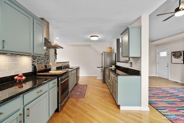 432 S Cherry St, Itasca, IL 60143 - kitchen with stainless steel appliances, exhaust hood, light wood-type flooring, backsplash, and a ceiling fan