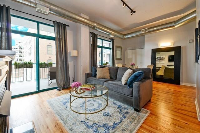 910 W Madison St Unit 501, Chicago, IL 60607 - living area with light wood finished floors and track lighting