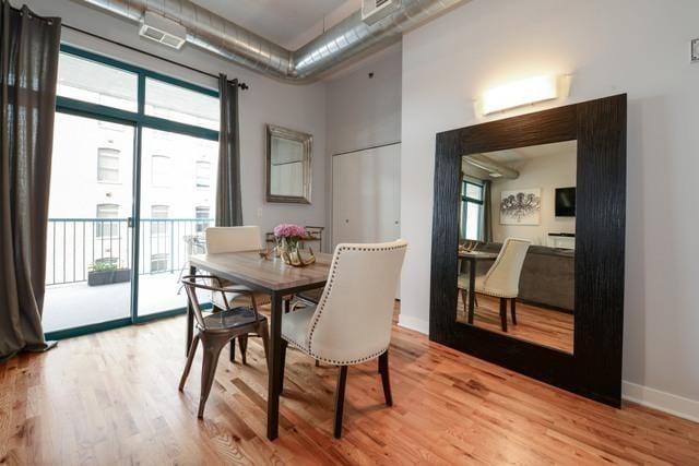 910 W Madison St Unit 501, Chicago, IL 60607 - dining space with light wood-style flooring, a high ceiling, and plenty of natural light