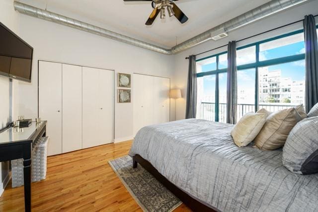 910 W Madison St Unit 501, Chicago, IL 60607 - bedroom featuring light wood finished floors, multiple closets, and ceiling fan