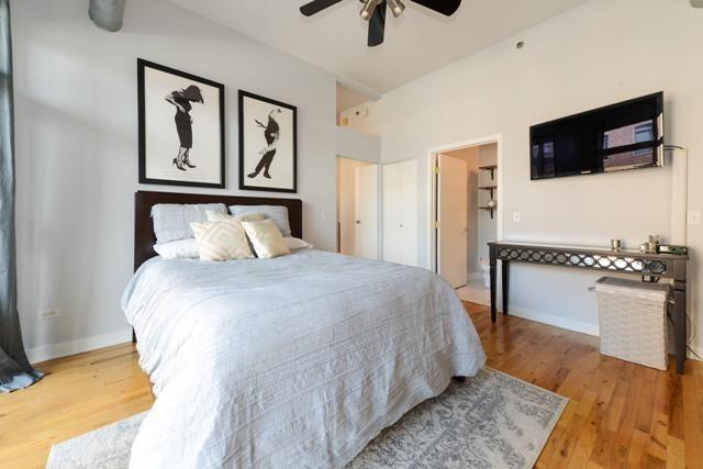 910 W Madison St Unit 501, Chicago, IL 60607 - bedroom with wood finished floors and ceiling fan