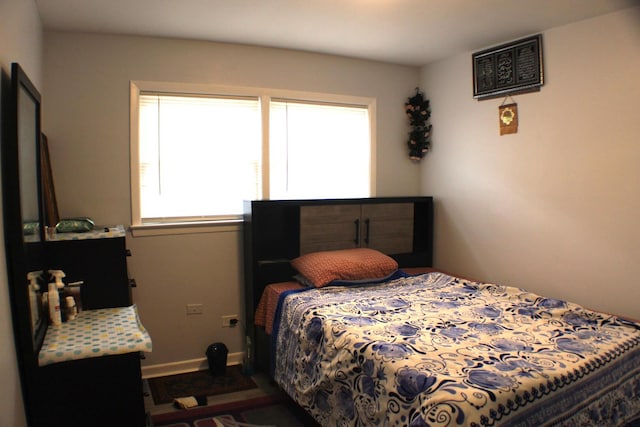 bedroom featuring baseboards