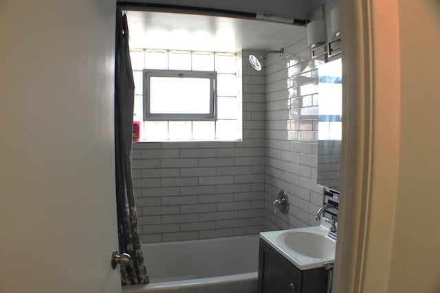 bathroom featuring vanity and shower / tub combo with curtain