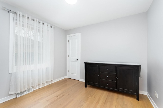 interior space with visible vents, baseboards, and light wood-style floors