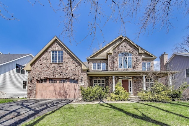 1056 W Willow St, Palatine, IL 60067 - view of front of home featuring aphalt driveway, a front lawn, and brick siding