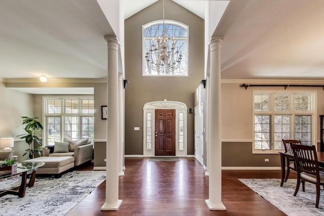 1056 W Willow St, Palatine, IL 60067 - foyer entrance with baseboards, ornate columns, a notable chandelier, and dark wood-style floors