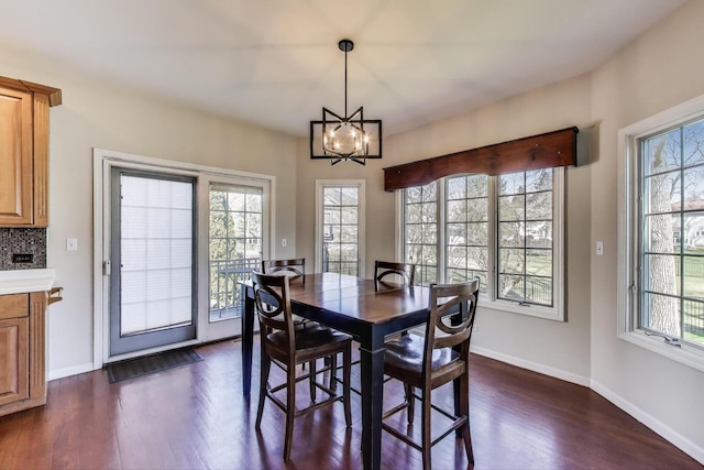 1056 W Willow St, Palatine, IL 60067 - dining area featuring an inviting chandelier, baseboards, plenty of natural light, and dark wood-style flooring