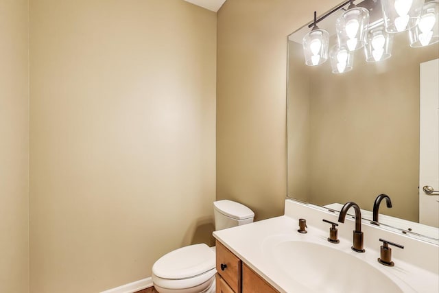 1056 W Willow St, Palatine, IL 60067 - bathroom with toilet, a chandelier, and vanity