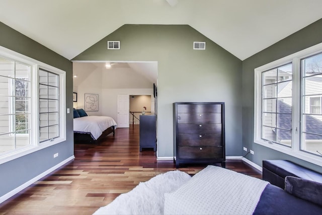 1056 W Willow St, Palatine, IL 60067 - bedroom with wood finished floors, multiple windows, lofted ceiling, and visible vents