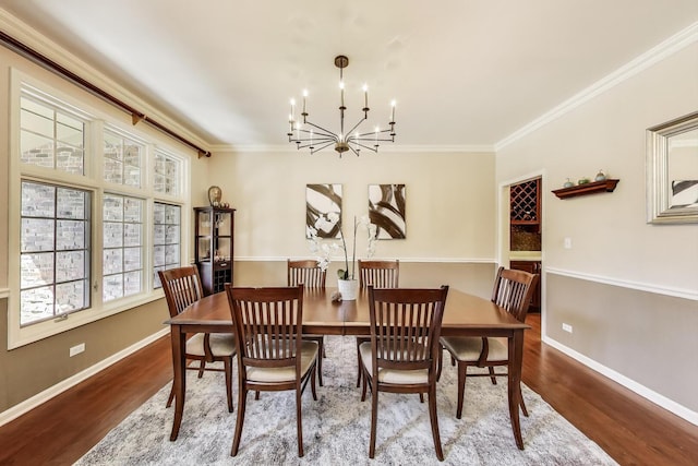 1056 W Willow St, Palatine, IL 60067 - dining area with crown molding, wood finished floors, a notable chandelier, and baseboards