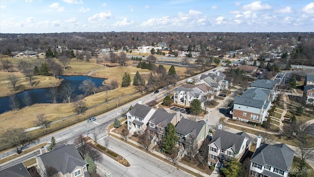 drone / aerial view featuring a residential view and a water view