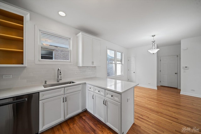 6005 River Bend Dr, Lisle, IL 60532 - kitchen featuring stainless steel dishwasher, a peninsula, wood finished floors, and a sink