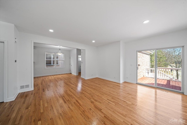 unfurnished living room featuring light wood-style flooring, recessed lighting, and visible vents