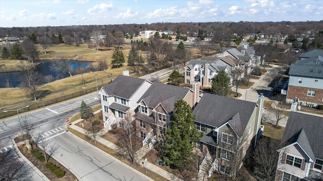 aerial view with a residential view and a water view