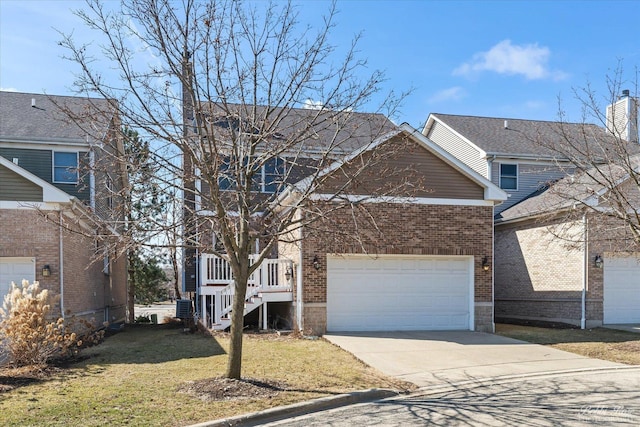 traditional-style house featuring brick siding, cooling unit, concrete driveway, and a front yard