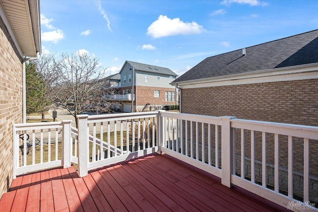 wooden deck featuring a residential view