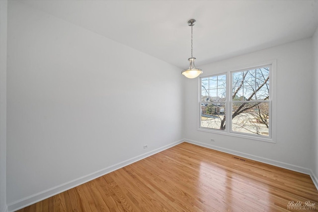 6005 River Bend Dr, Lisle, IL 60532 - empty room with visible vents, baseboards, and light wood finished floors