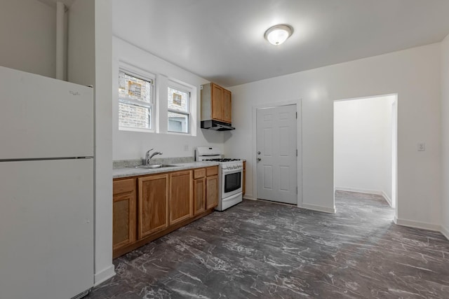 kitchen featuring a sink, white appliances, brown cabinetry, and light countertops