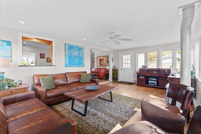 living room featuring ceiling fan, healthy amount of natural light, light wood finished floors, and recessed lighting