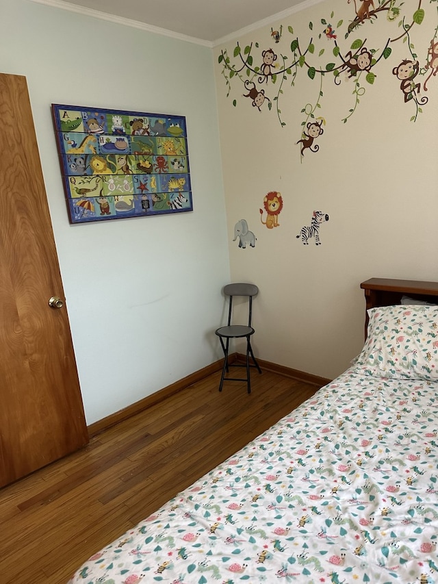 6724 W 114th St, Worth, IL 60482 - bedroom featuring wood finished floors, crown molding, and baseboards