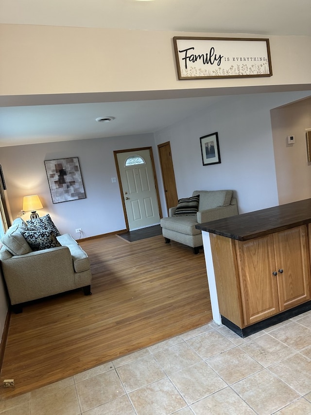 6724 W 114th St, Worth, IL 60482 - living room featuring light tile patterned flooring and baseboards