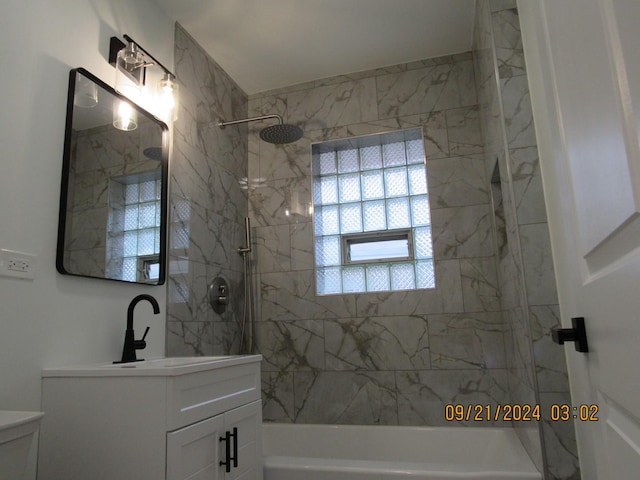 bathroom featuring tub / shower combination and vanity