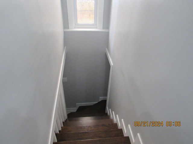 stairs with wood finished floors