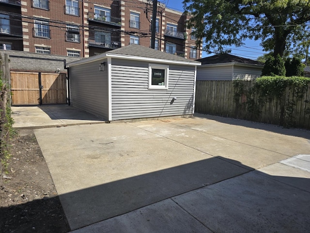 garage with fence and a gate