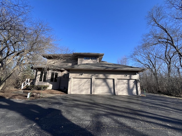 exterior space featuring a garage and driveway