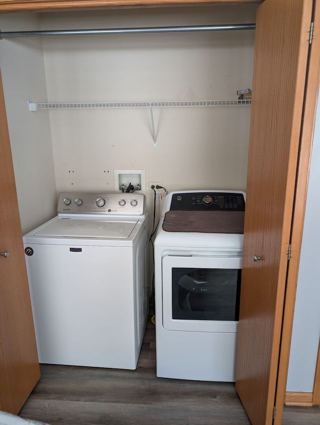 laundry area featuring laundry area, dark wood-style floors, and washing machine and dryer