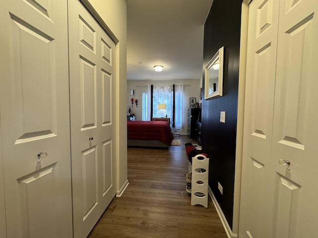 997 Regent Dr, Matteson, IL 60443 - hallway with dark wood-style flooring and baseboards