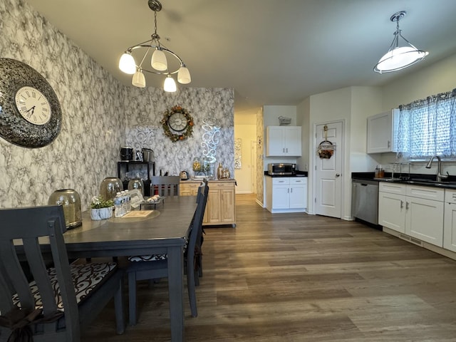997 Regent Dr, Matteson, IL 60443 - dining space featuring dark wood finished floors, wallpapered walls, and a chandelier