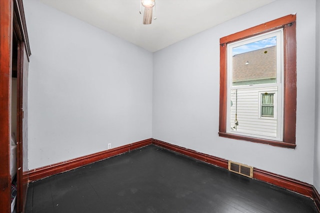 spare room with visible vents and baseboards