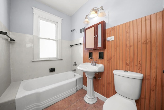 bathroom with tile patterned floors, visible vents, toilet, and shower / tub combination