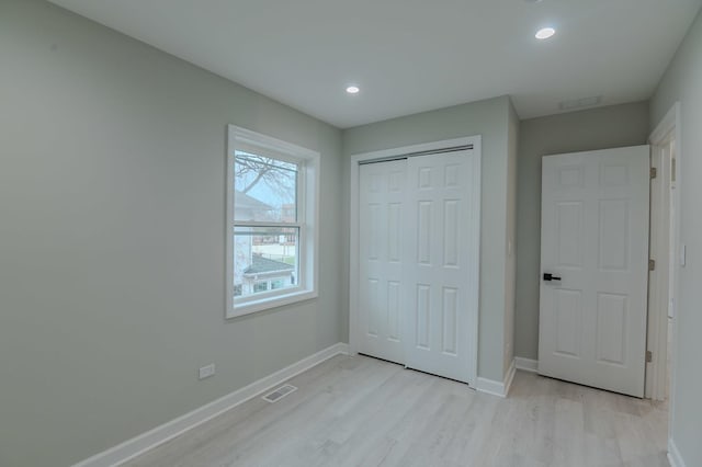 1131 S Ridgeland Ave, Oak Park, IL 60304 - unfurnished bedroom featuring visible vents, light wood-type flooring, and baseboards