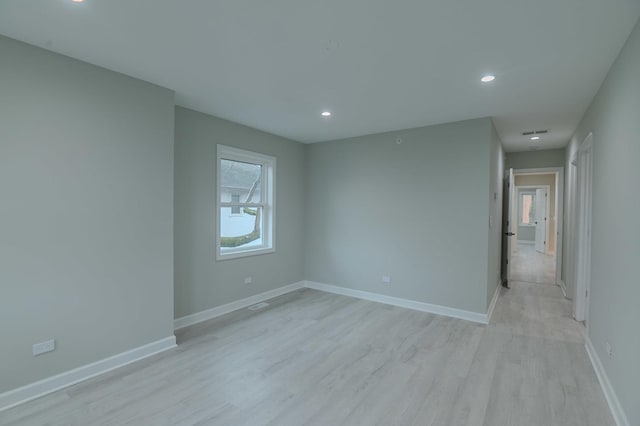 1131 S Ridgeland Ave, Oak Park, IL 60304 - spare room featuring recessed lighting, light wood-type flooring, and baseboards